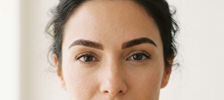 Straight-on portrait showing how a shaped brow frames the whole face