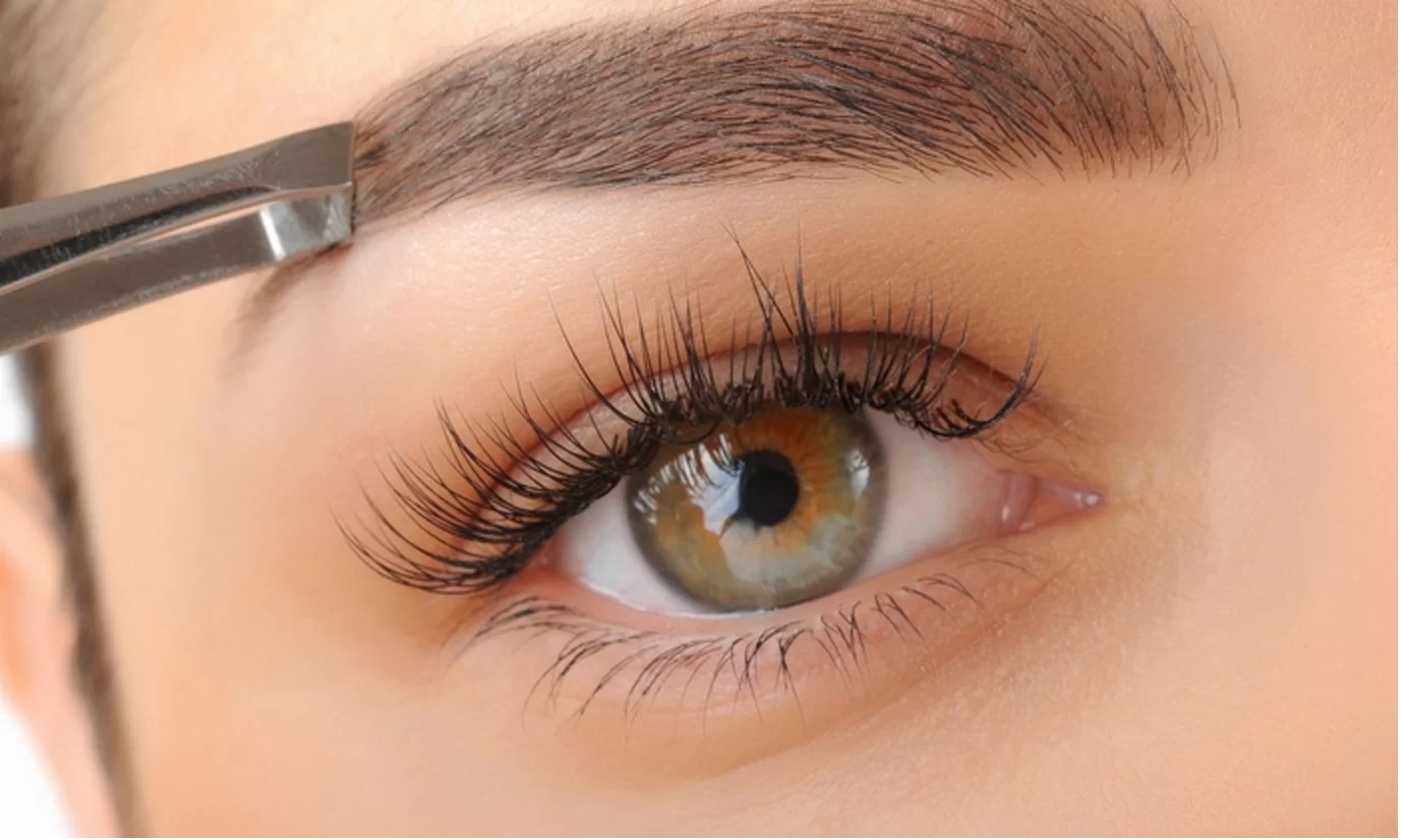 Brow tweezing close up at Bare Skin Waxing